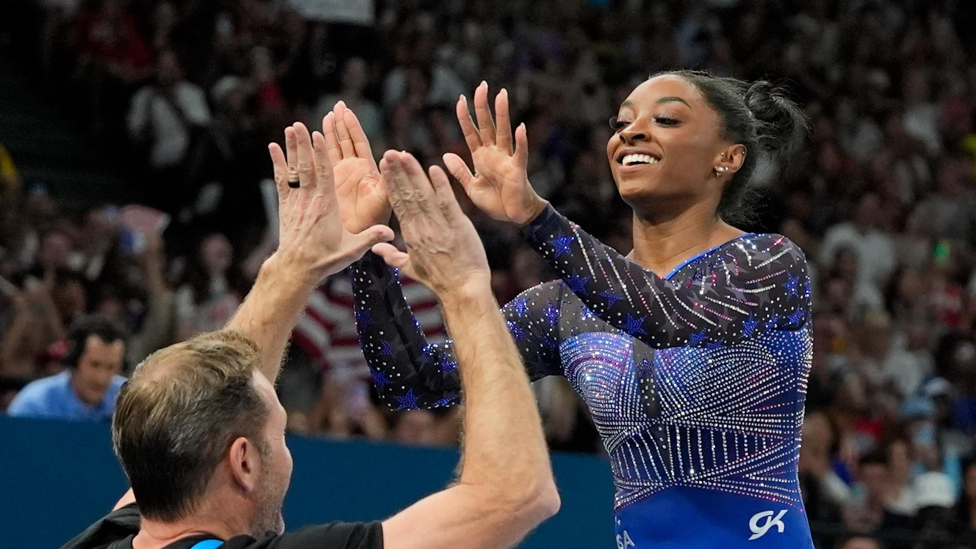 Why do US gymnasts wear different color leotards?