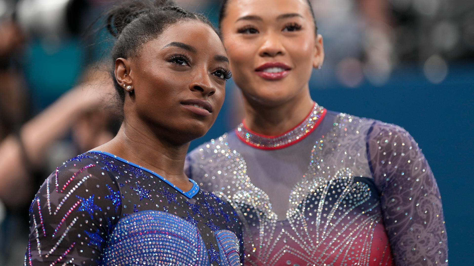 Why do US gymnasts wear different color leotards?