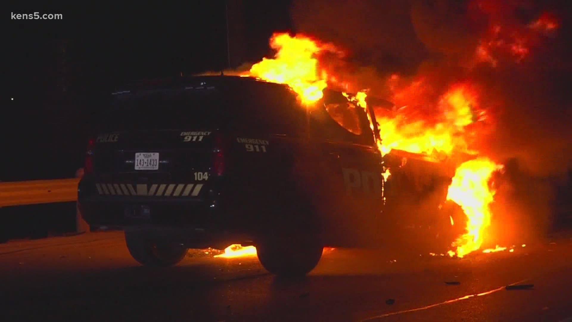 A Von Ormy officer's patrol car burst into flames after a wrong-way driver crashed into him, the San Antonio Police Department said.
