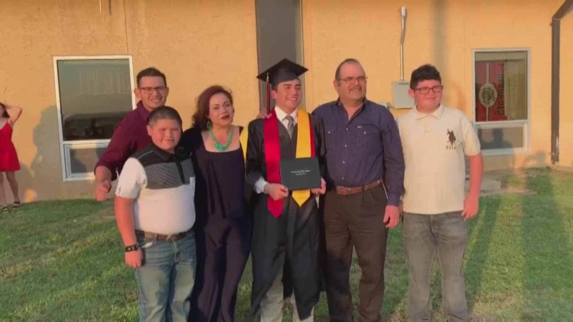 The soldier and brother of the high school graduate photobombed his family at graduation.