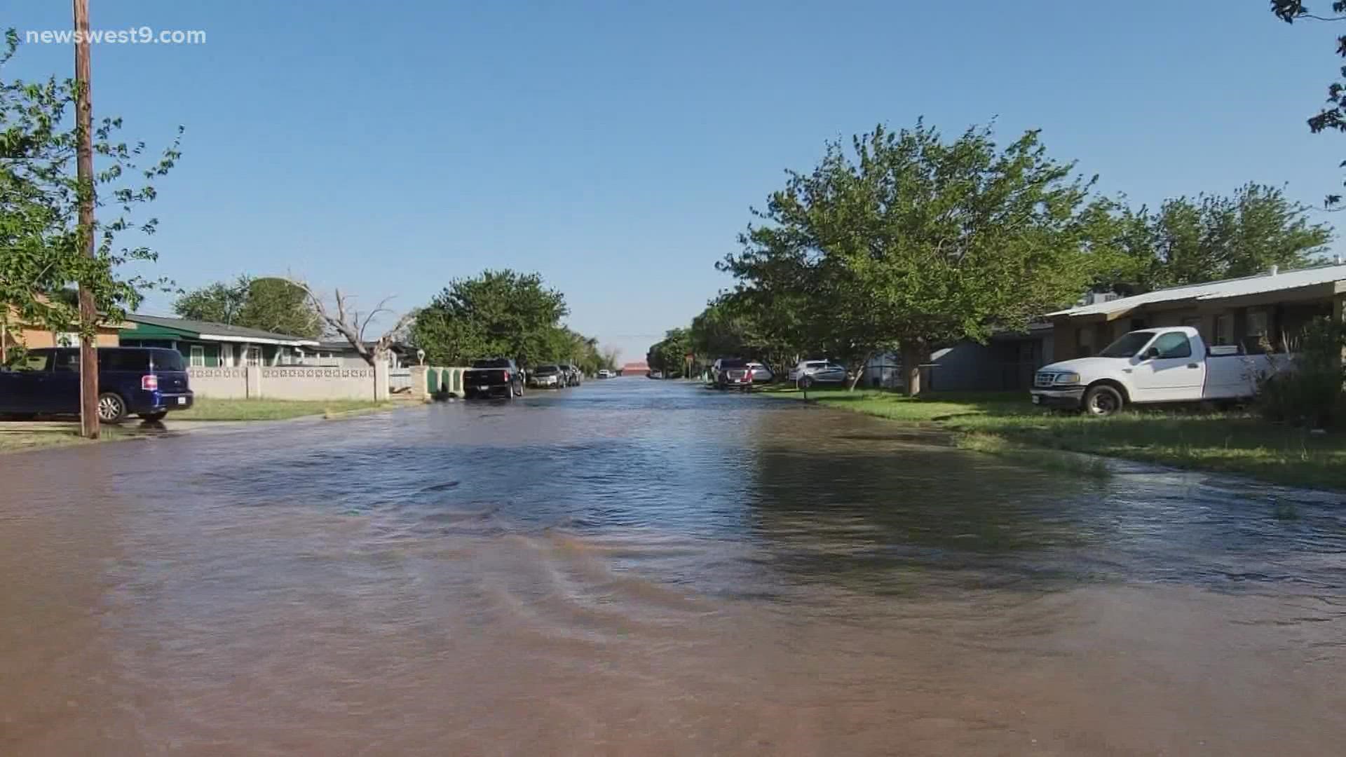 The break, located at the intersection of 42nd Street and San Jacinto Street, has caused flooding in the area.