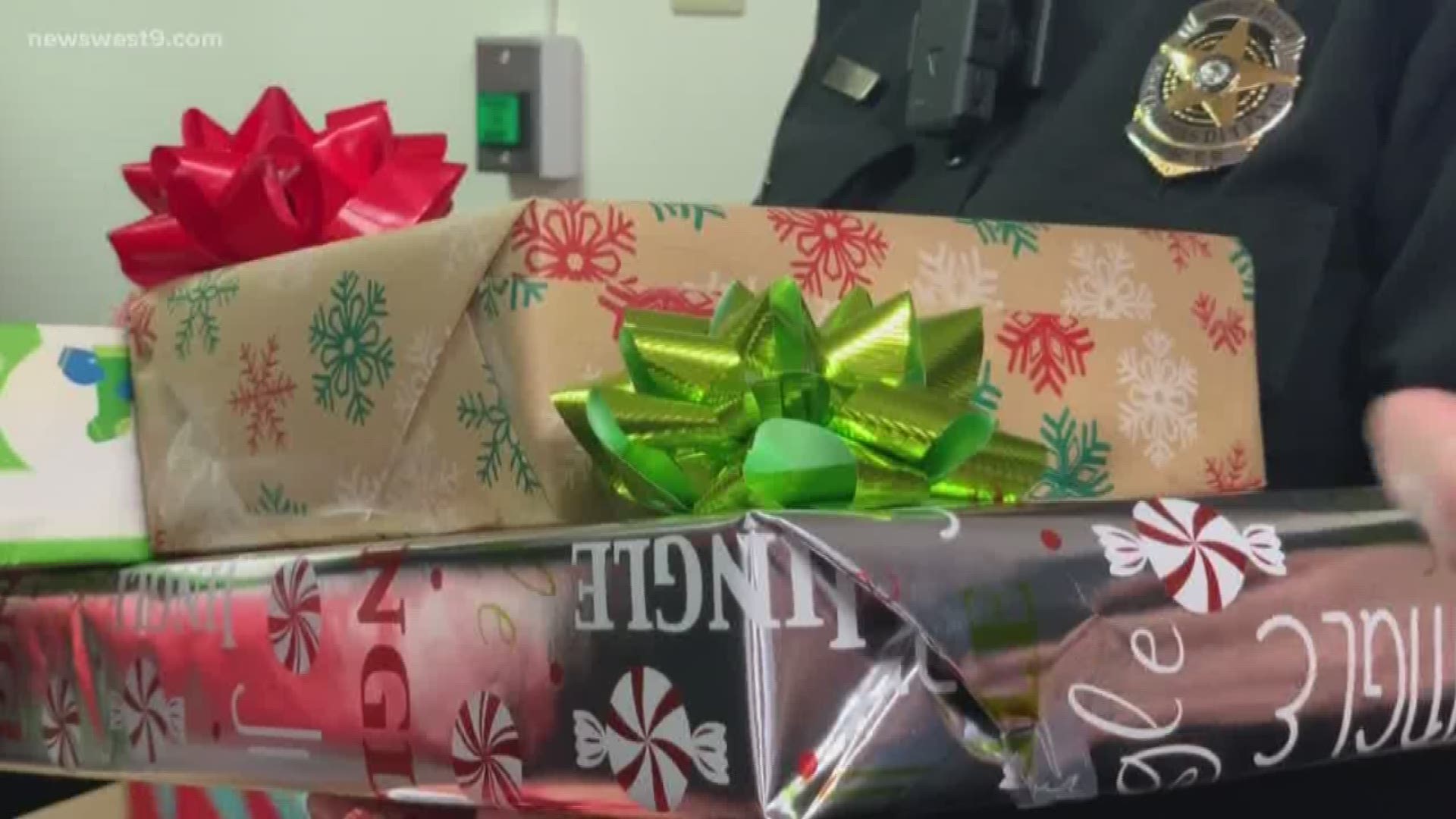 The police department works with ECISD Community Outreach Center to identify struggling families to buy them presents.