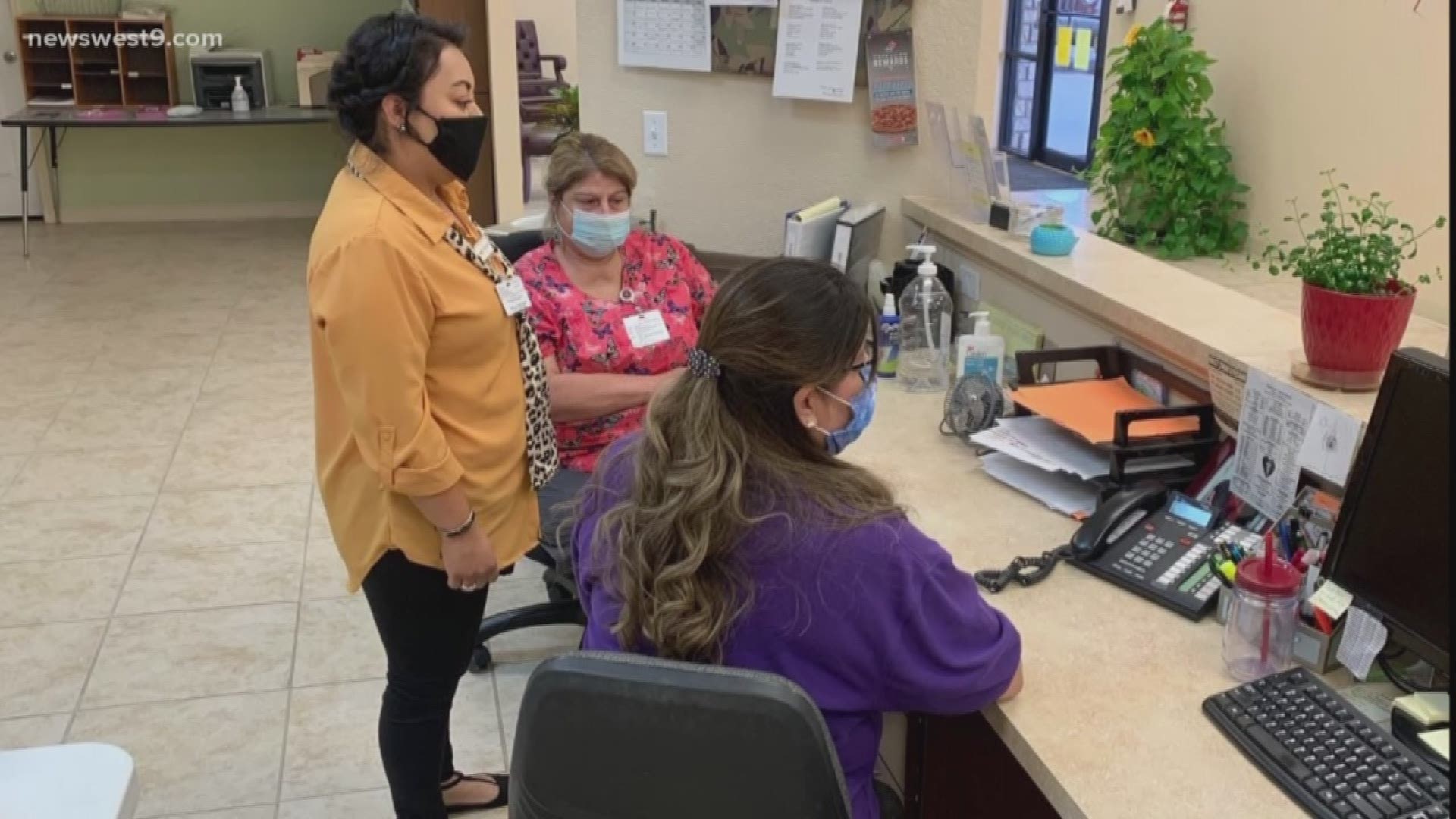 Employees stood or sat silent for a moment to honor the life of the front line worker who died due to COVID-19