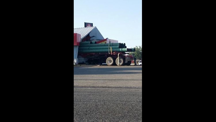 pick up truck driver fails to yield causes semi to plow through texaco station newswest9 com pick up truck driver fails to yield