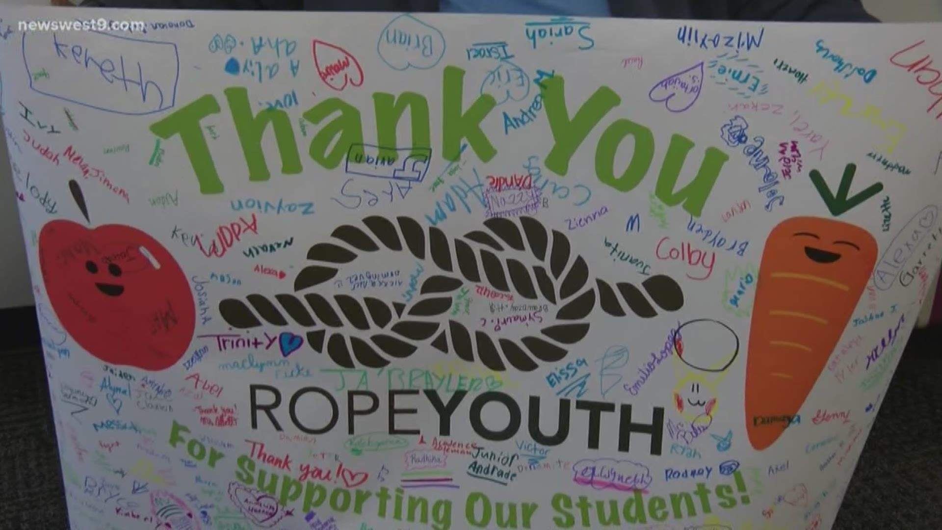 Karl Boroski and his company Rope for Youth received a banner of appreciation for their $22.8K donation to pay off MISD student lunch debt.