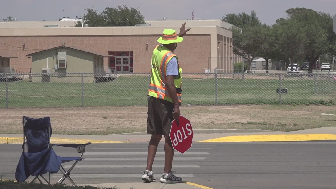 Friendly local crossing guard given gifts by community