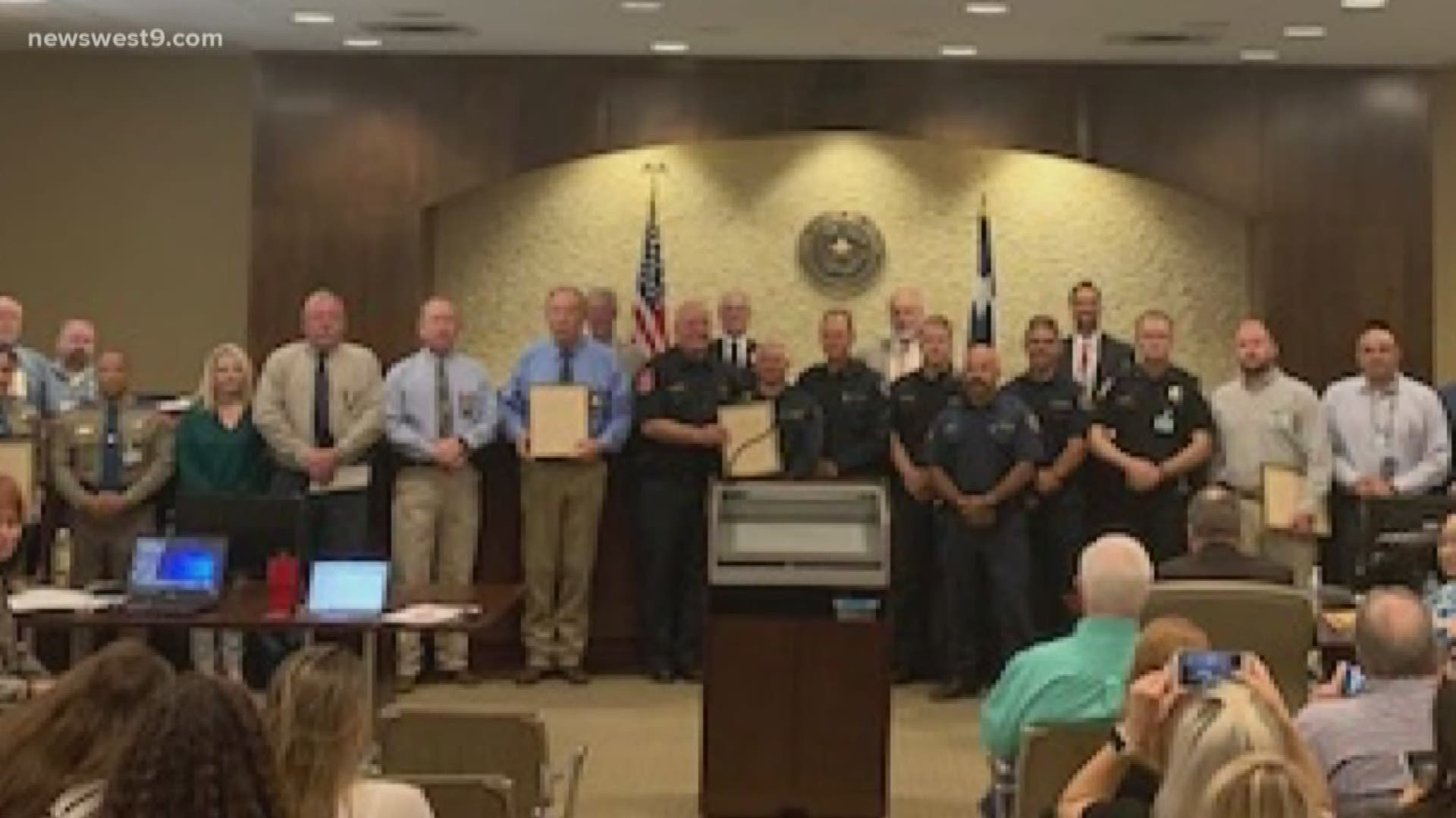 County commissioners signed a resolution honoring those who risked their lives during the August 31 shooting.