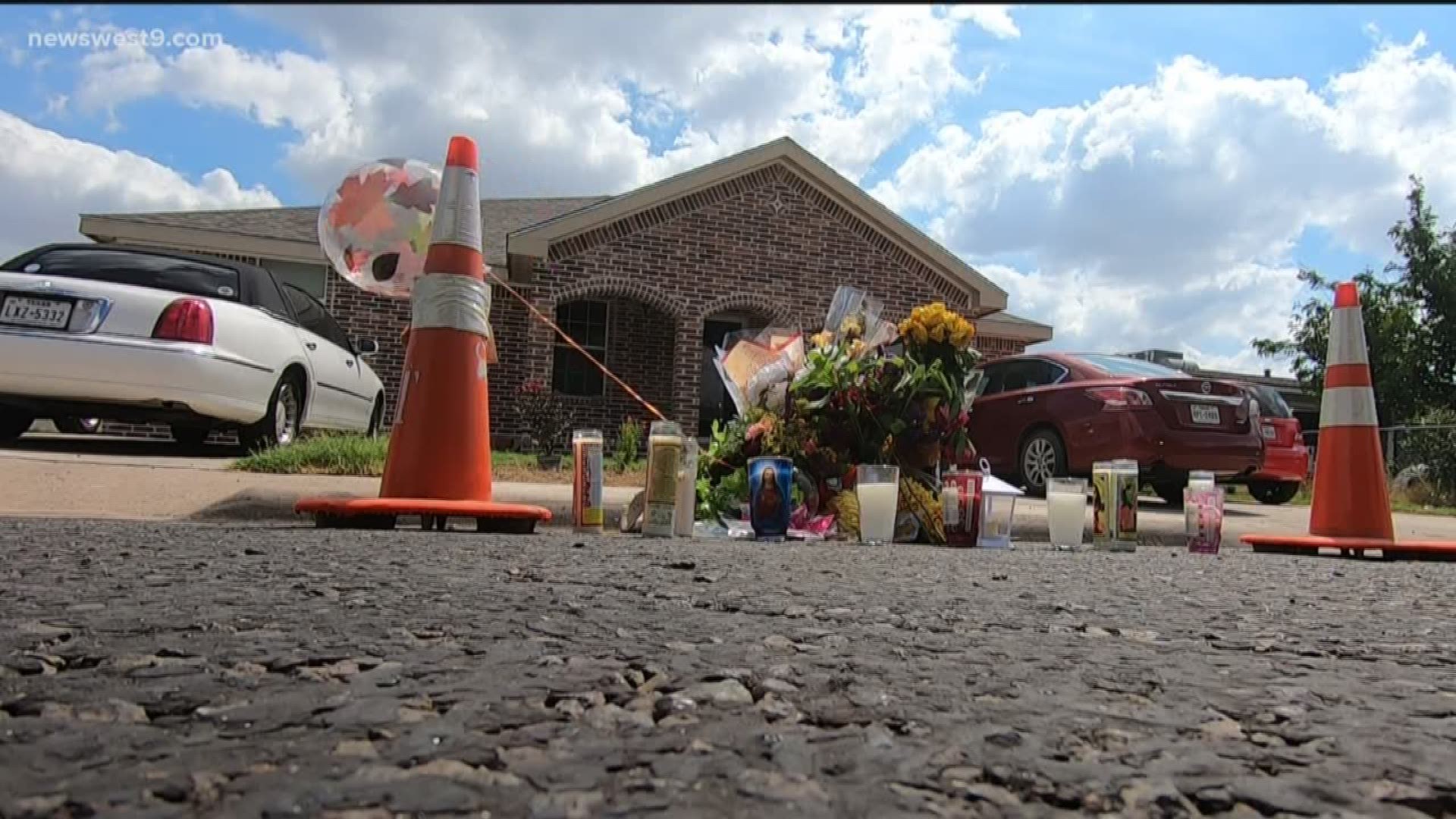 A temporary memorial for postal worker Mary Granados has been set up where she was shot on Adams Avenue in Odessa.