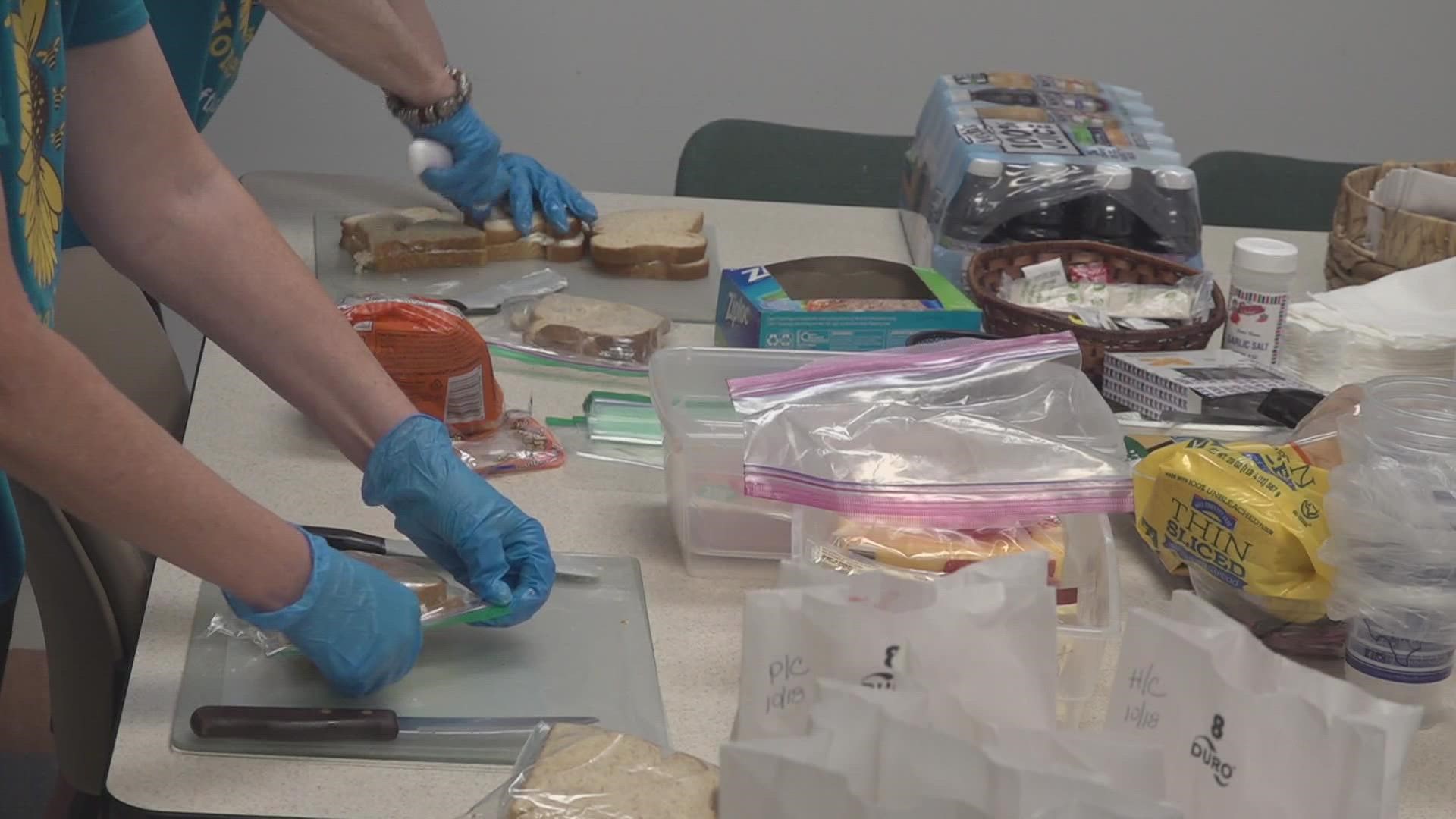 Every Wednesday, the Hope House Honeybees who are breast cancer survivors, make lunches at the Allison Cancer Center for patients sitting in a place they once were.