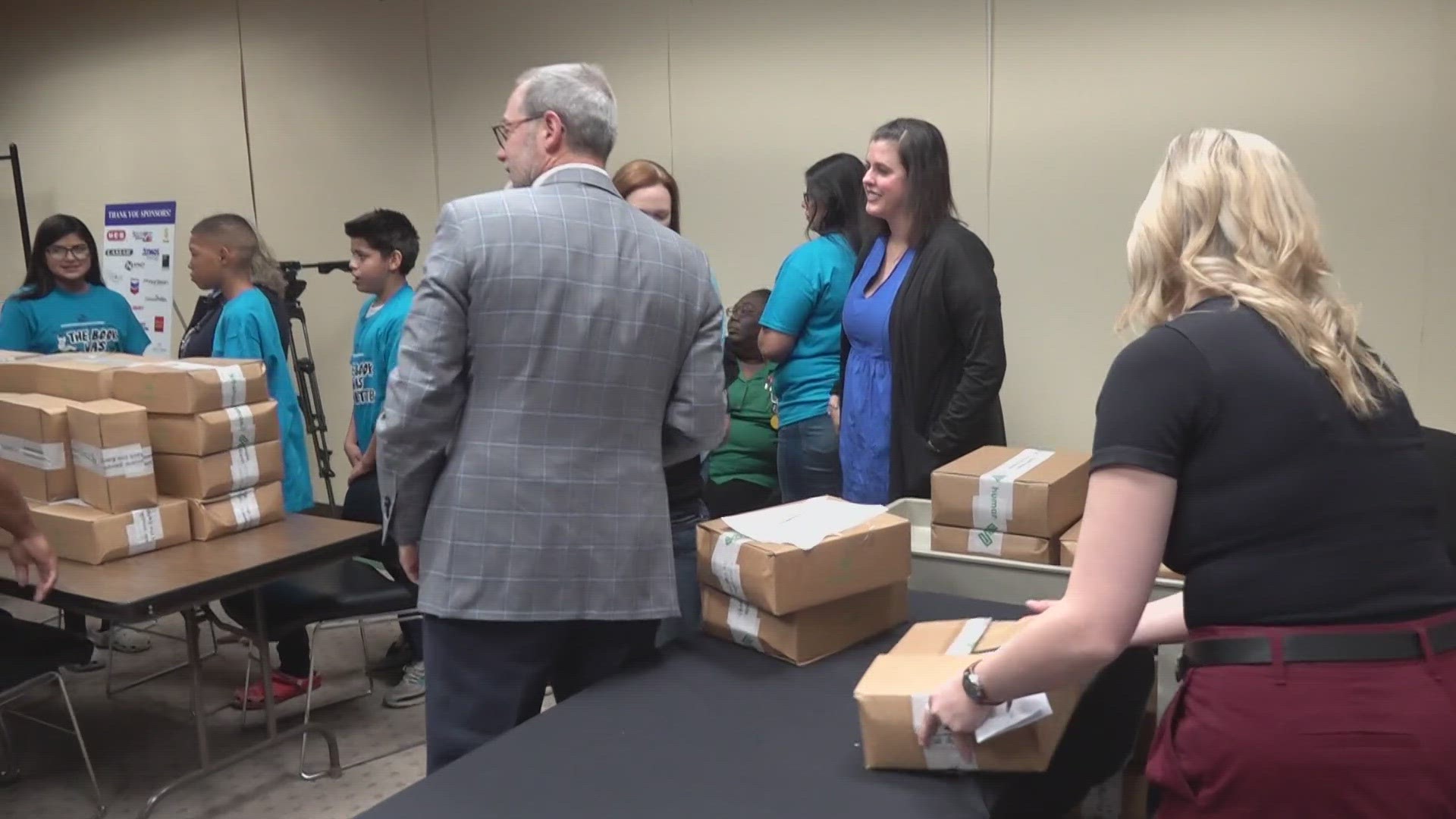 On Wednesday, AT&T handed out laptops to students and families in need.