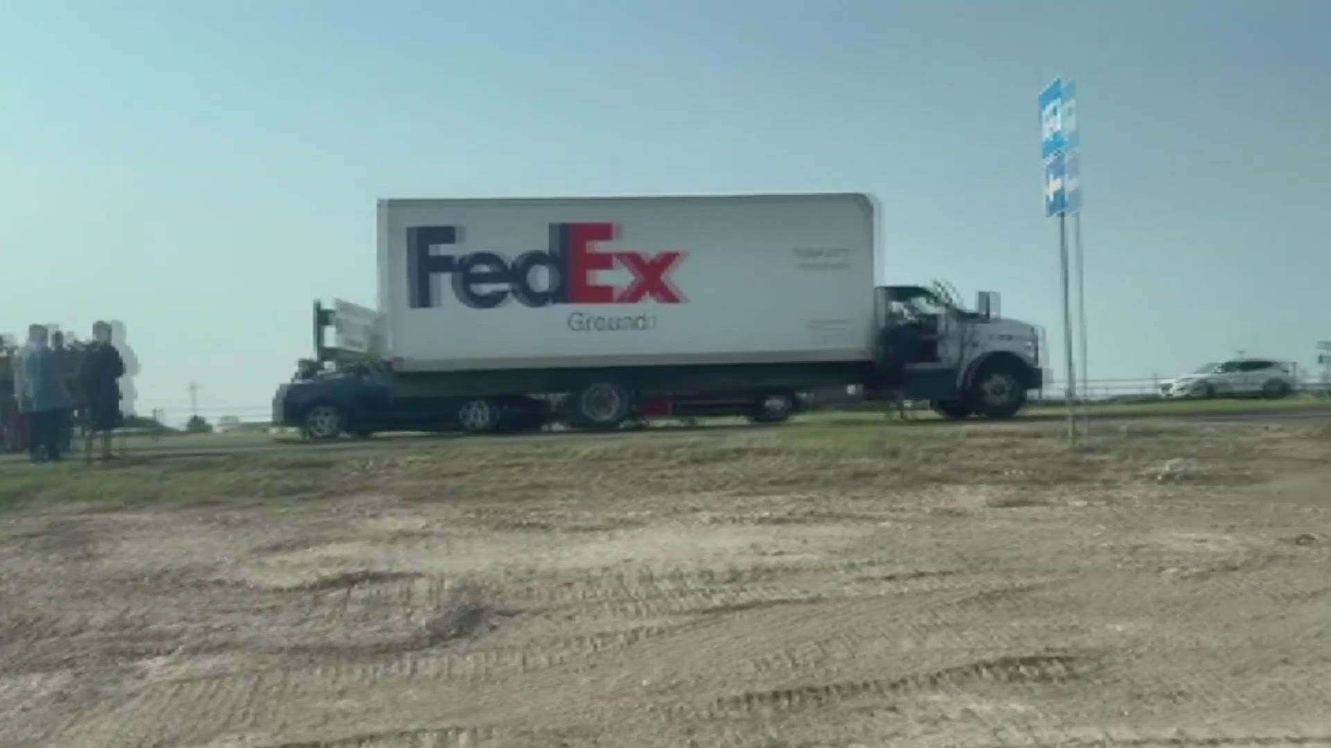 The incident involved a car that ended up beneath a FedEx truck on Business 20 and West County Road 127. Authorities have yet to release details.