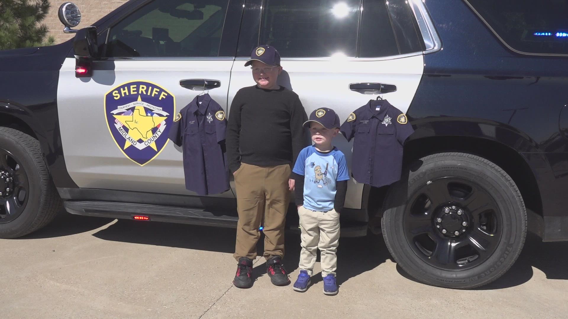 6-year-old and 3-year-old Maverick and Mason Stokes become honorary deputies for a day in Midland.