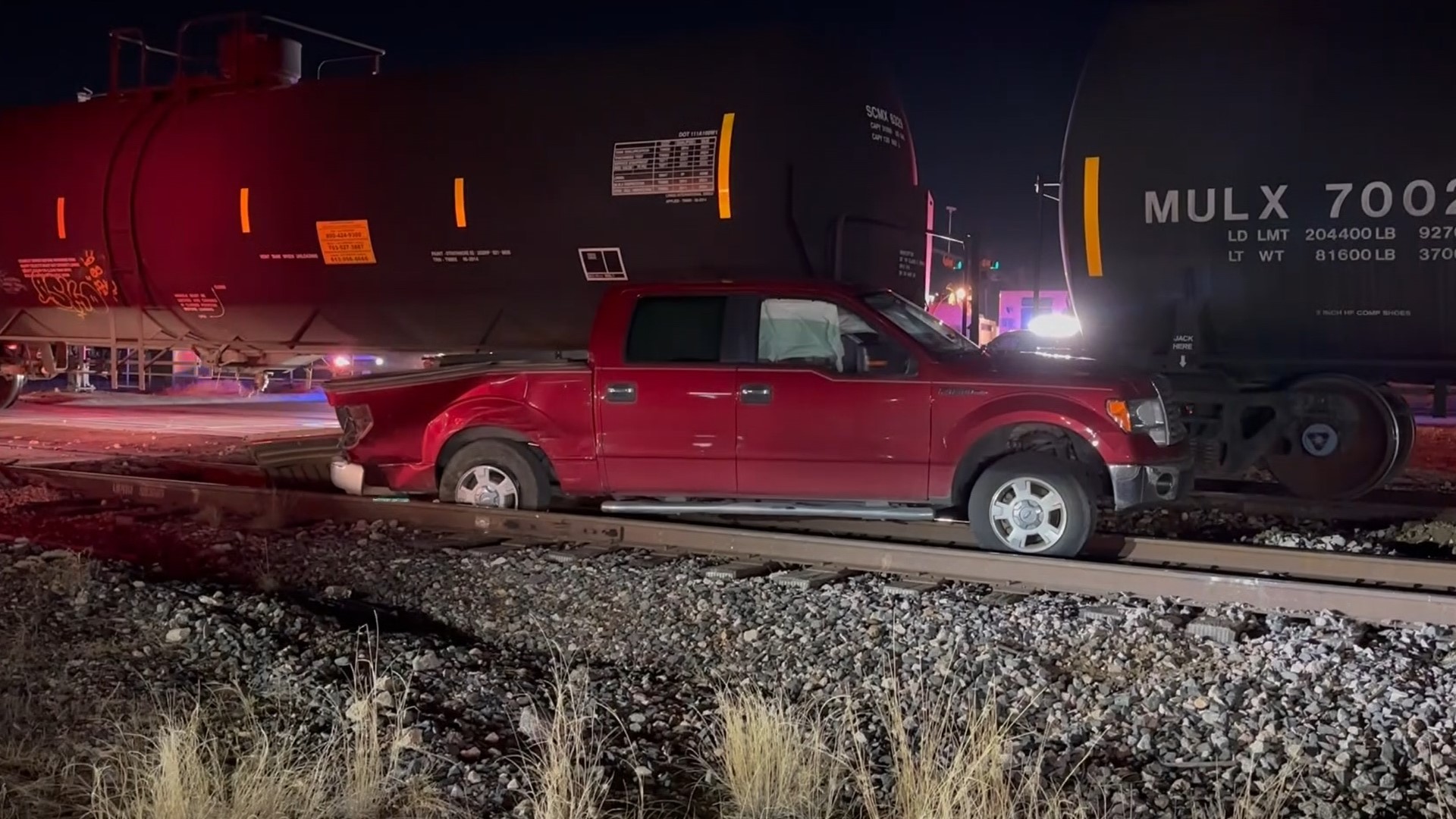 The truck was hit by the train after it got stuck on the tracks.
