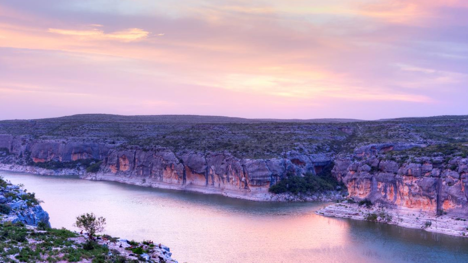 Pecos River Guarded by Isolation, Bound by Reservoirs