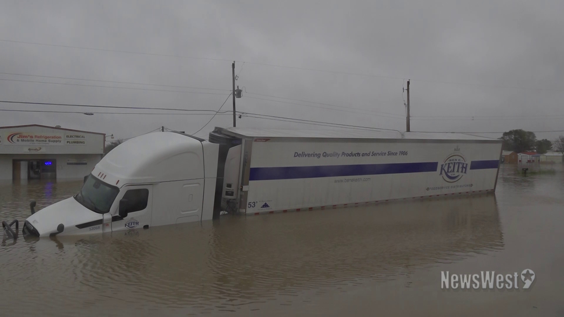 Due to recent severe flooding in Odessa, a 18-wheeler was stuck in a flooded road.