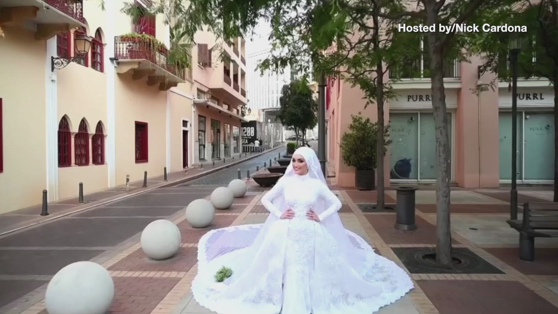 Footage shows the woman holding her bouquet in a square in Lebanon on the day of her wedding.