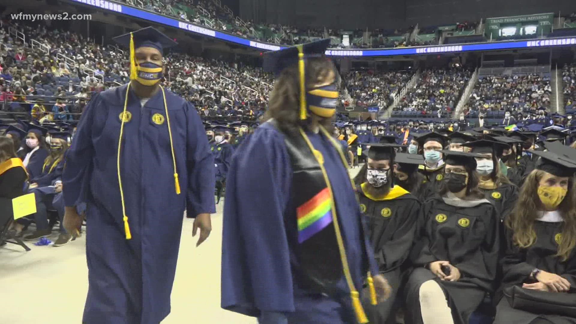 A couple who got married in 1995 walked the stage together at UNCG’s 2021 fall commencement ceremony.