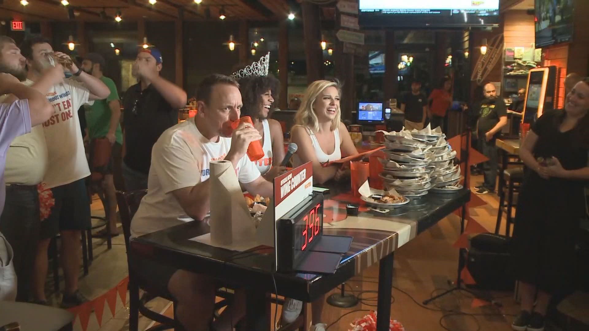 Joey Chestnut pulled up a chair at the Mall of Georgia Hooters for a marathon chicken-wing-eating display.